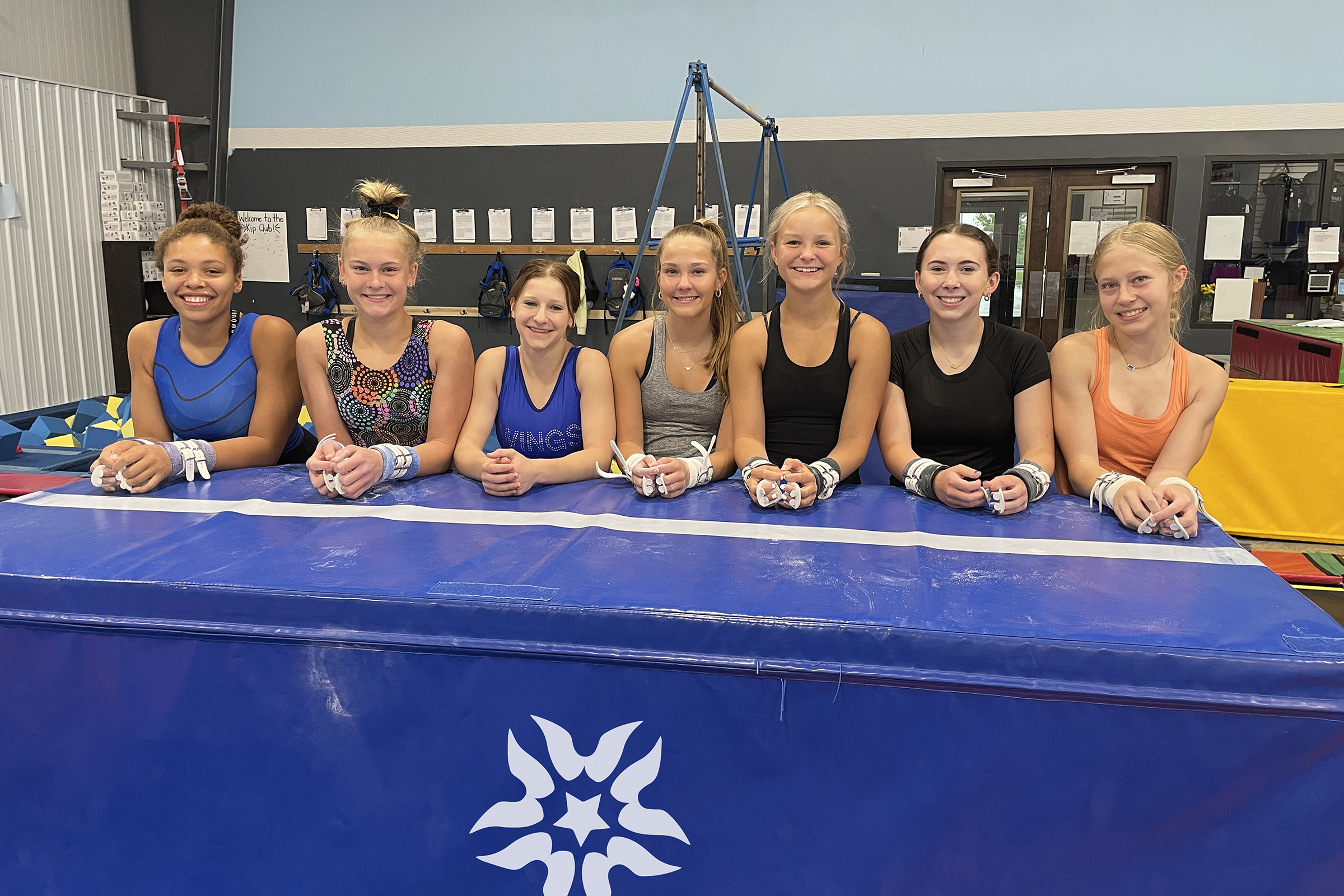High school gymnasts getting ready to start off season practice at Wings!